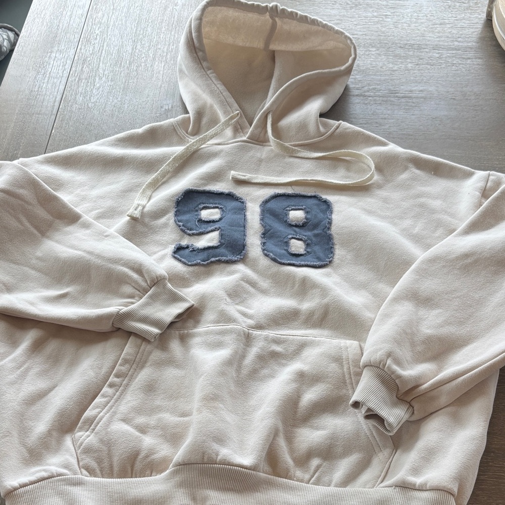 Edikted Cream Crewneck Hoodie with Distressed Blue '98' Patch